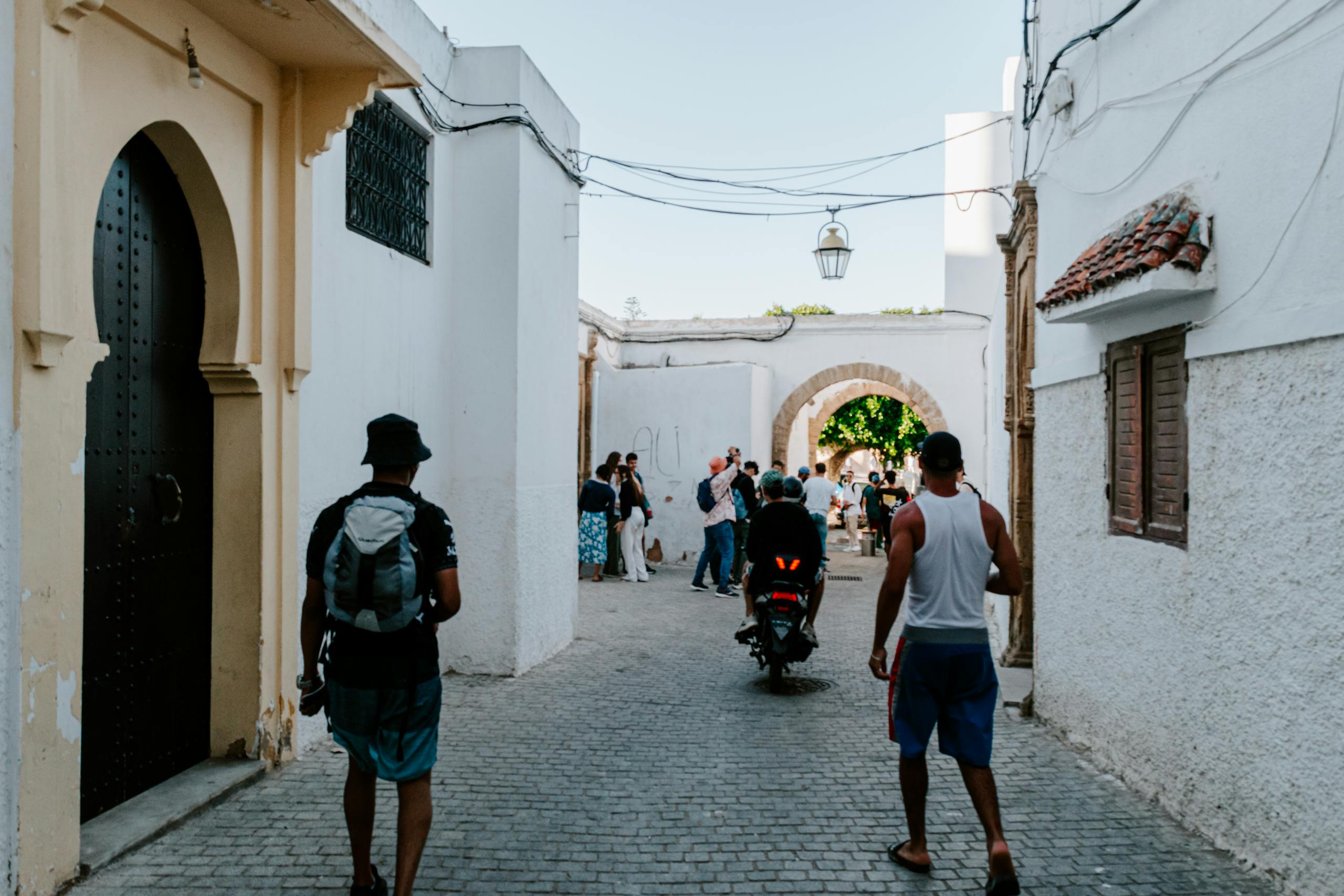 A vibrant scene capturing everyday life in the streets of Rabat, Morocco.