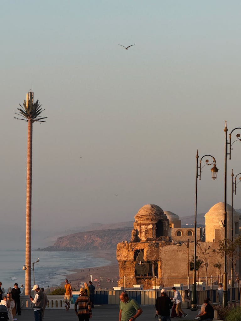 Explore the historic architecture and coastal beauty of Larache, Morocco at sunset. Ideal for travel enthusiasts.