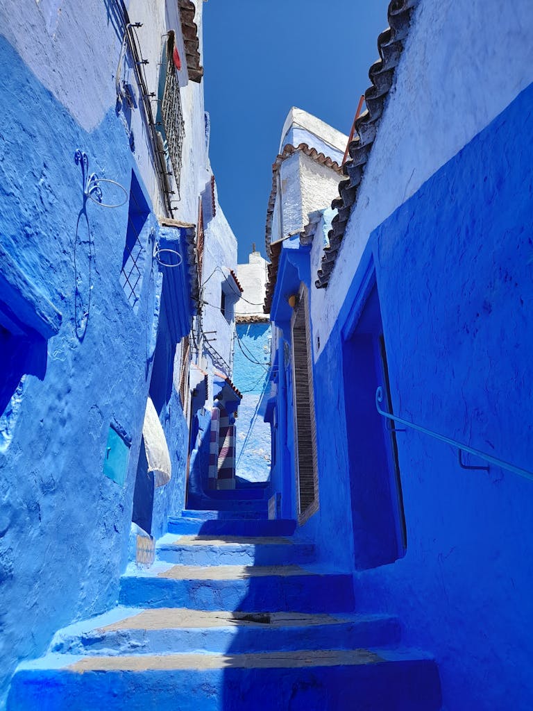 Explore the iconic blue alleyways of Chefchaouen, Morocco.