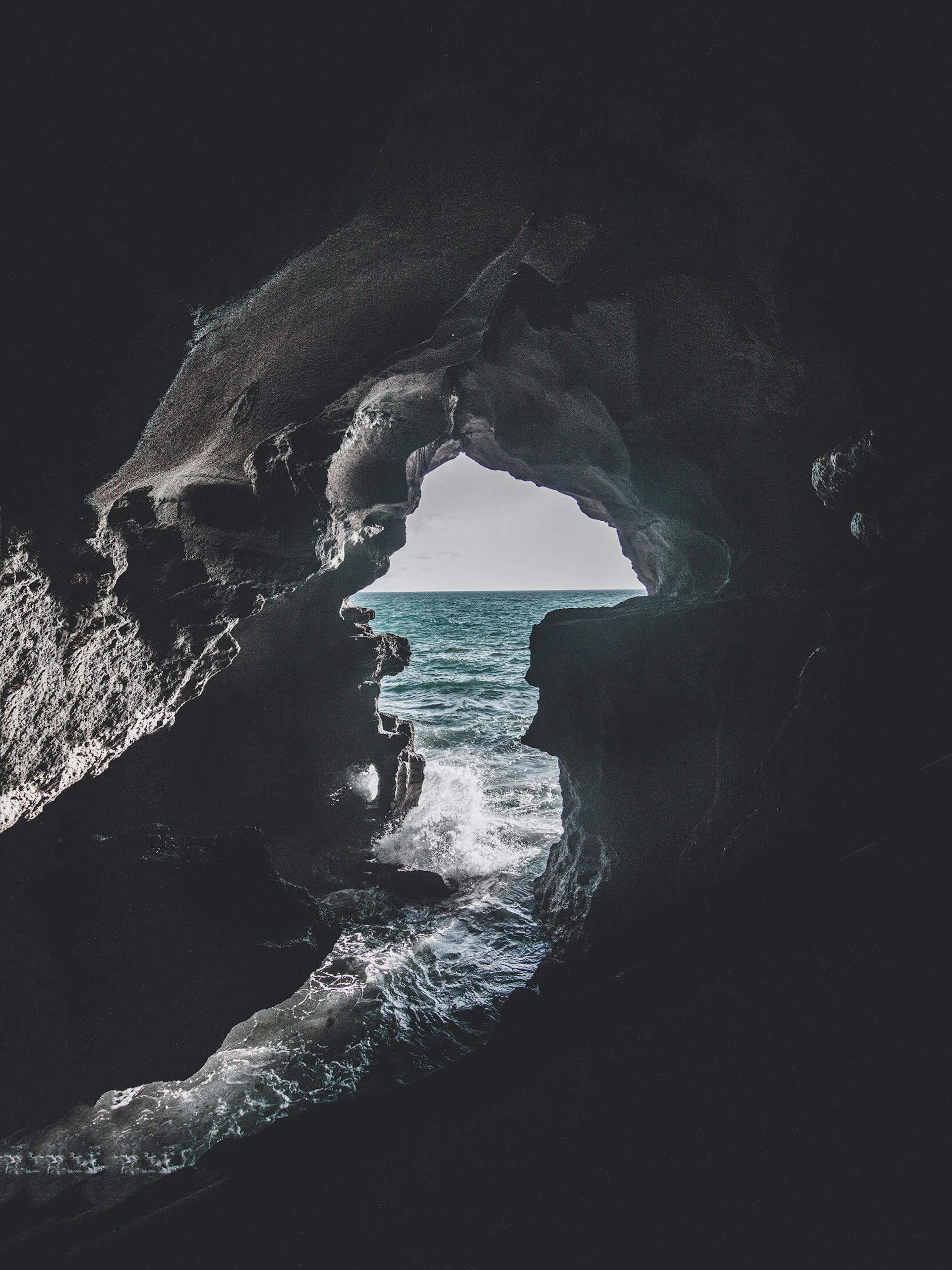 Costa Atlántica ocean view from a cave in Morocco, showcasing the play of light and shadow.